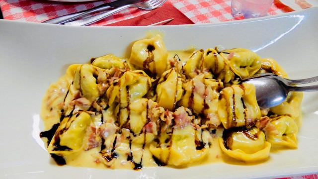 Learn how to make tortellini from scratch and enjoy the rich and decadent flavors of Italian food in Italy.